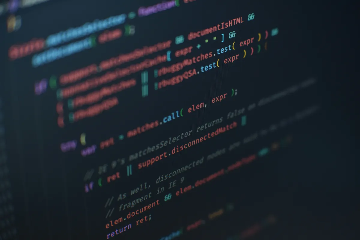 Close-up of colour-highlighted source code on a dark screen